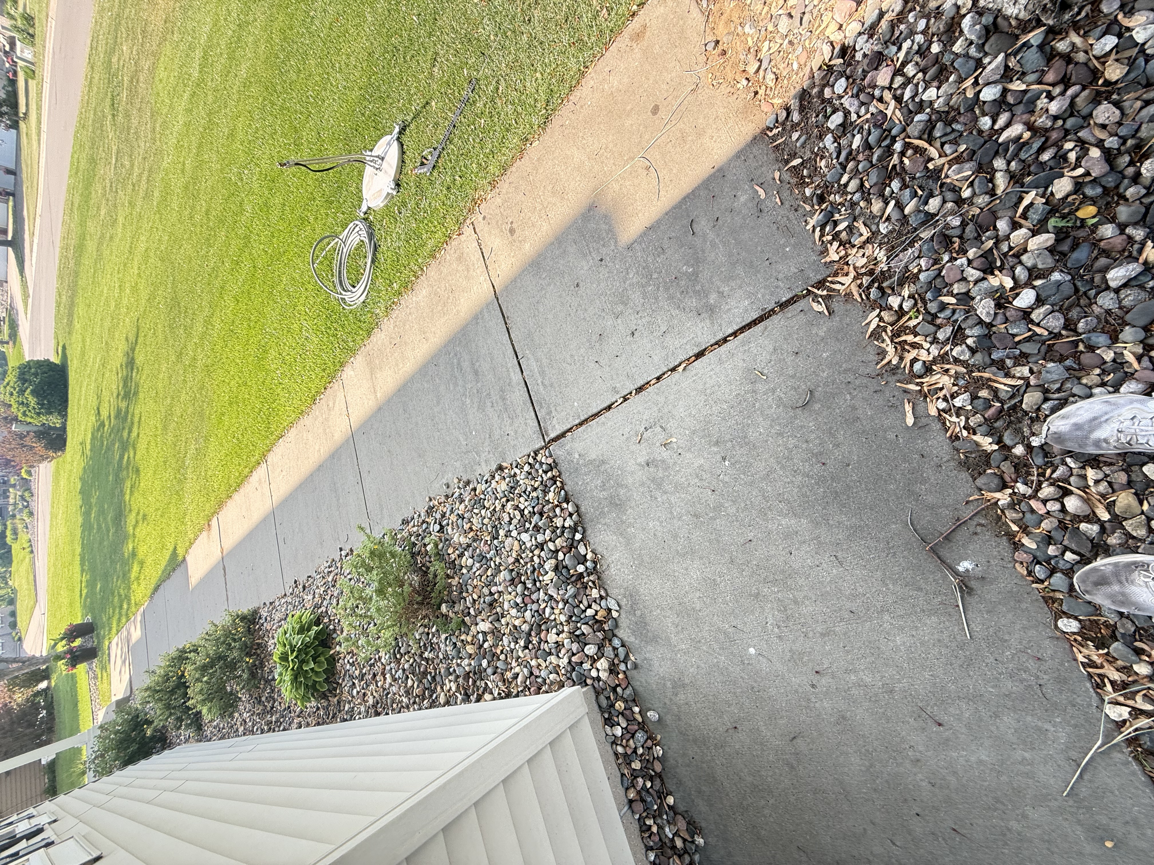 Dirty stained concrete driveway before cleaning